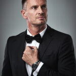He plays the role perfectly. Shot of a mature man in a tuxedo